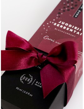 Wrapping the product with a dark red ribbon + scent spraying