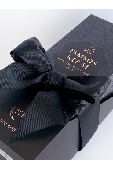 Wrapping the product with a wide black ribbon